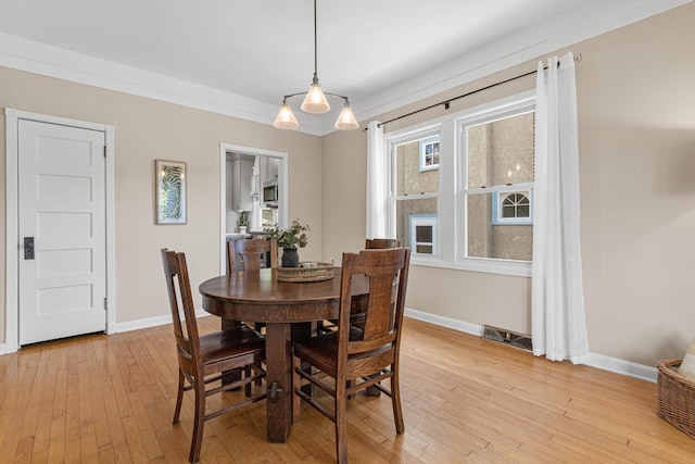 500 Otis Ave, Saint Paul, MN 55104 - dining area featuring light wood-style flooring and baseboards