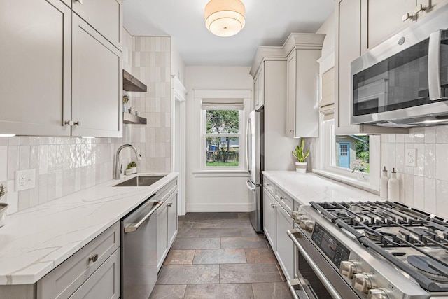 500 Otis Ave, Saint Paul, MN 55104 - kitchen with appliances with stainless steel finishes, open shelves, light stone counters, and decorative backsplash
