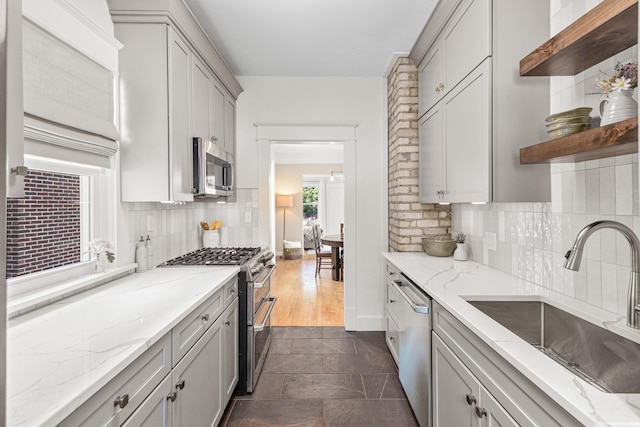 500 Otis Ave, Saint Paul, MN 55104 - kitchen with stainless steel appliances, open shelves, and gray cabinets