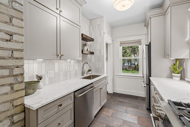500 Otis Ave, Saint Paul, MN 55104 - kitchen featuring stainless steel appliances, open shelves, decorative backsplash, stone tile flooring, and light stone countertops