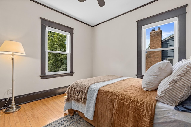 500 Otis Ave, Saint Paul, MN 55104 - bedroom featuring hardwood / wood-style floors, ornamental molding, and a ceiling fan