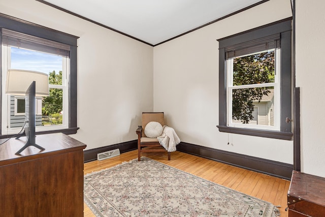 500 Otis Ave, Saint Paul, MN 55104 - sitting room with wood-type flooring, healthy amount of natural light, and ornamental molding