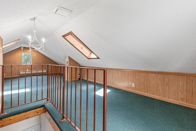 500 Otis Ave, Saint Paul, MN 55104 - bonus room with vaulted ceiling, a skylight, a textured ceiling, baseboard heating, and wooden walls