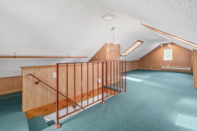 500 Otis Ave, Saint Paul, MN 55104 - bonus room featuring a textured ceiling, lofted ceiling, wood walls, baseboard heating, and carpet flooring