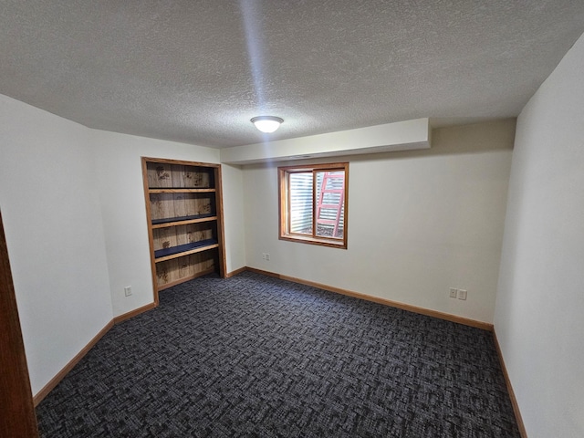 21578 Edwards Dr, Irondale Twp, MN 56455 - empty room featuring a textured ceiling and dark colored carpet
