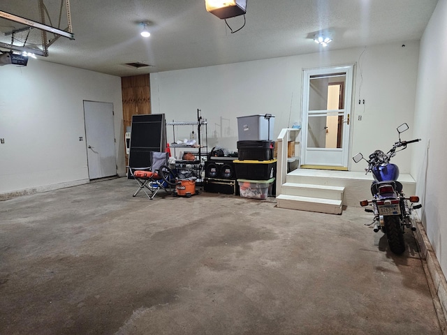 21578 Edwards Dr, Irondale Twp, MN 56455 - garage featuring a garage door opener