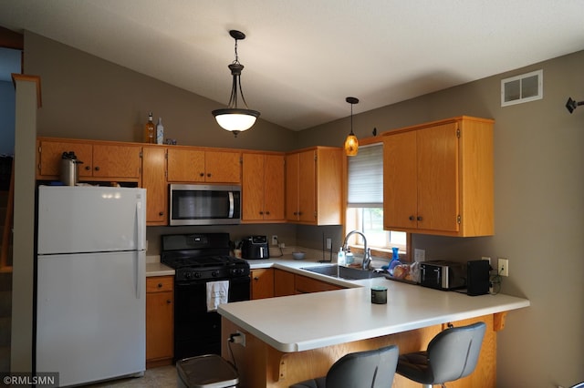 11223 Diane Ave, Becker, MN 55308 - kitchen with freestanding refrigerator, stainless steel microwave, black range with gas stovetop, light countertops, and a peninsula