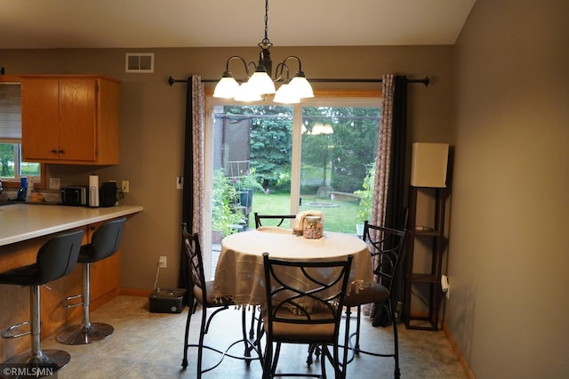11223 Diane Ave, Becker, MN 55308 - dining area featuring a chandelier and light tile patterned floors