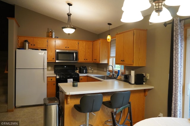 11223 Diane Ave, Becker, MN 55308 - kitchen featuring freestanding refrigerator, stainless steel microwave, black gas stove, vaulted ceiling, and light countertops