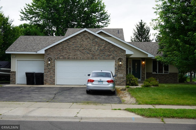 11223 Diane Ave, Becker, MN 55308 - ranch-style home with a garage, driveway, a front lawn, and roof with shingles