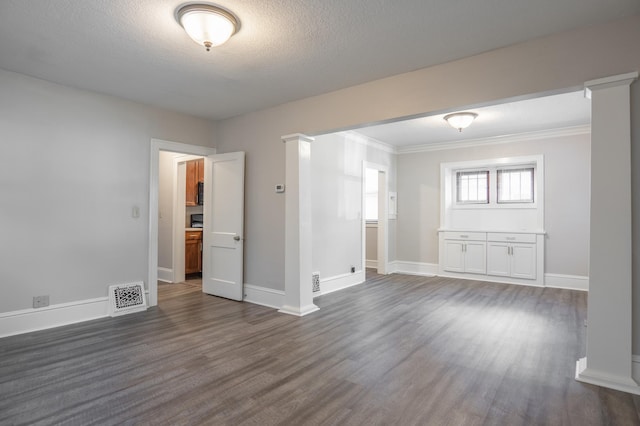3919 Dupont Ave N, Minneapolis, MN 55412 - empty room with dark wood-type flooring, ornamental molding, and a textured ceiling