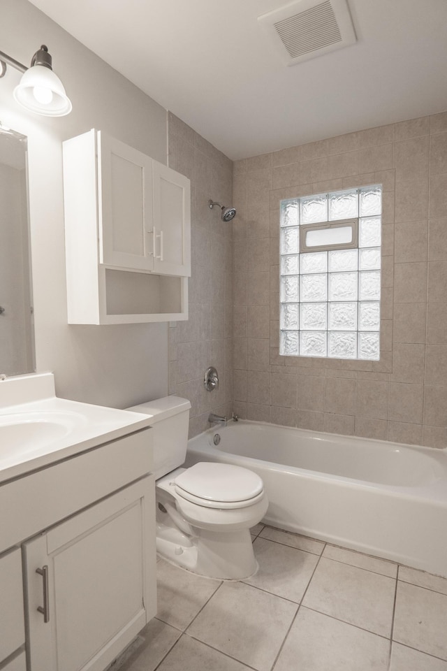 3919 Dupont Ave N, Minneapolis, MN 55412 - full bath featuring vanity, tile patterned floors, and washtub / shower combination