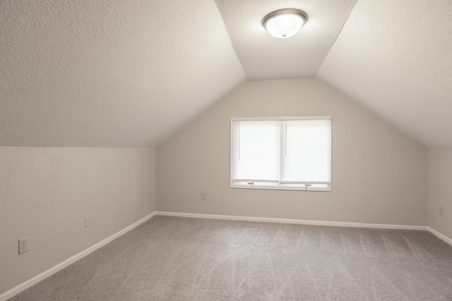 3919 Dupont Ave N, Minneapolis, MN 55412 - additional living space featuring carpet flooring, a textured ceiling, and lofted ceiling