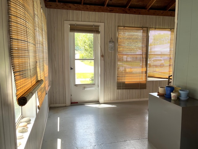 1157 6th Ave S, Windom, MN 56101 - entryway with wood walls and concrete floors