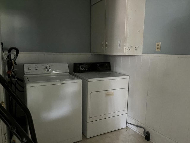 1157 6th Ave S, Windom, MN 56101 - laundry area with independent washer and dryer, cabinet space, and wainscoting