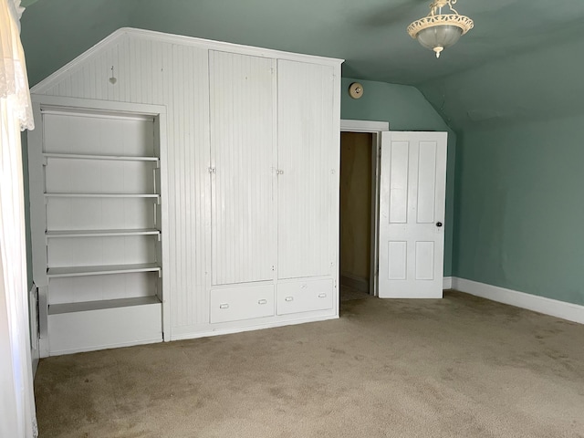 1157 6th Ave S, Windom, MN 56101 - unfurnished bedroom with vaulted ceiling and carpet floors