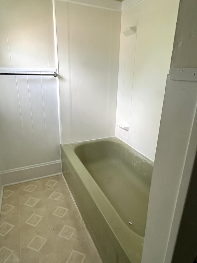 1157 6th Ave S, Windom, MN 56101 - bathroom featuring tile patterned floors and shower / washtub combination