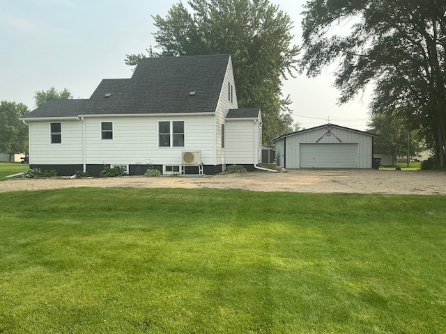 705 State Highway 28 W, Glenwood, MN 56334 - rear view of house featuring an outbuilding, a yard, a garage, and roof with shingles