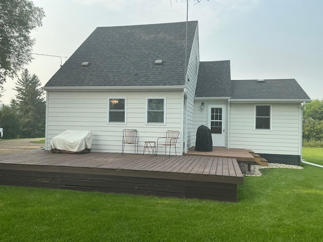705 State Highway 28 W, Glenwood, MN 56334 - rear view of house featuring a lawn, a deck, and roof with shingles