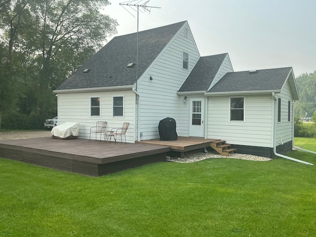 705 State Highway 28 W, Glenwood, MN 56334 - back of property featuring roof with shingles, a wooden deck, and a yard