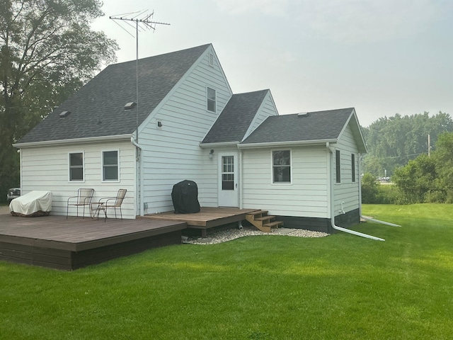 705 State Highway 28 W, Glenwood, MN 56334 - back of property featuring a shingled roof, a yard, and a deck