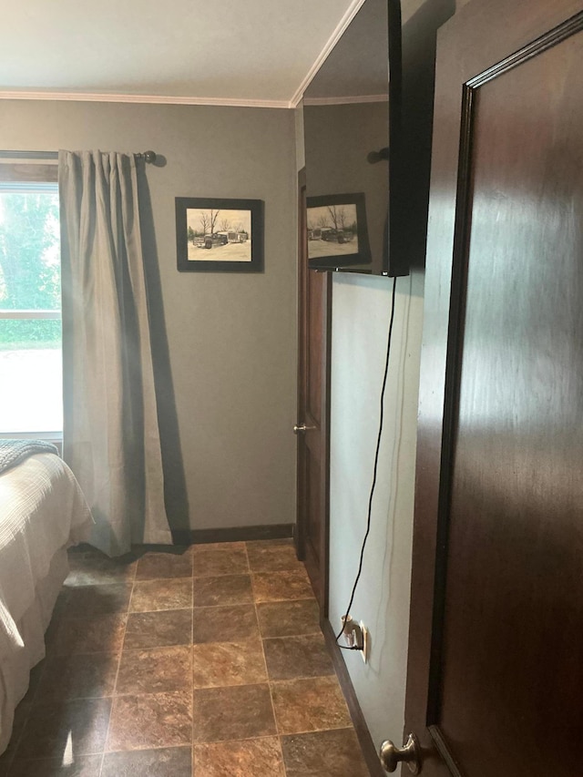 705 State Highway 28 W, Glenwood, MN 56334 - bedroom featuring ornamental molding and dark stone finish flooring