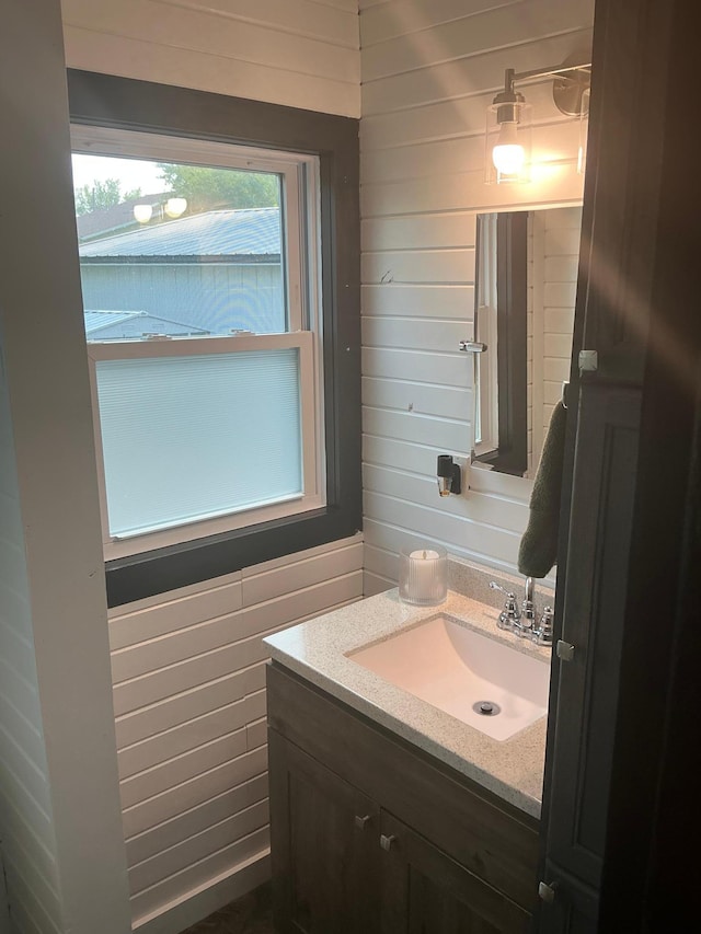 705 State Highway 28 W, Glenwood, MN 56334 - bathroom with vanity and wooden walls