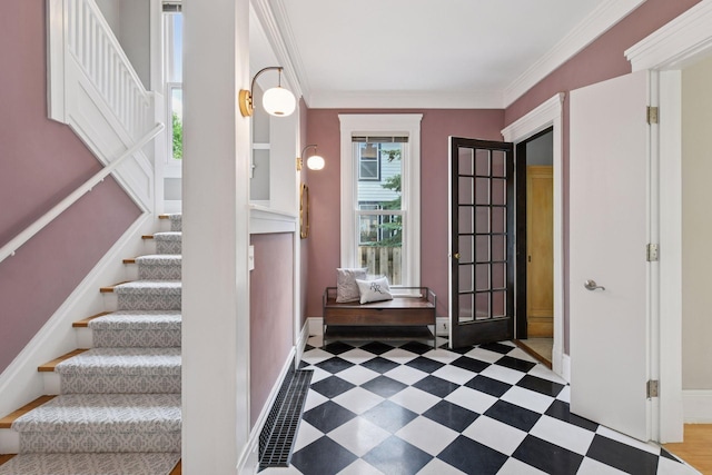 2432 Pleasant Ave, Minneapolis, MN 55404 - entryway featuring stairs, ornamental molding, and tile patterned floors