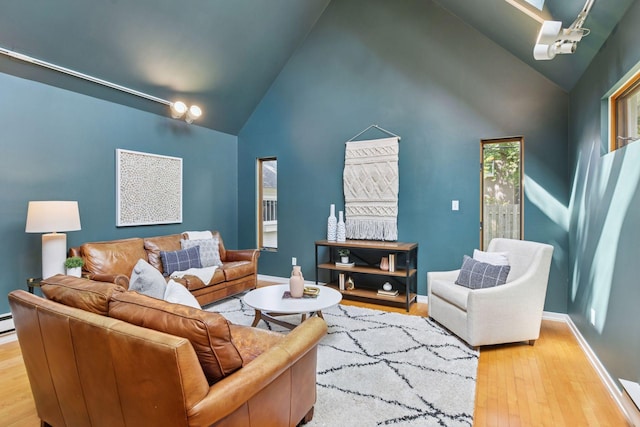 2432 Pleasant Ave, Minneapolis, MN 55404 - living area featuring wood finished floors and high vaulted ceiling