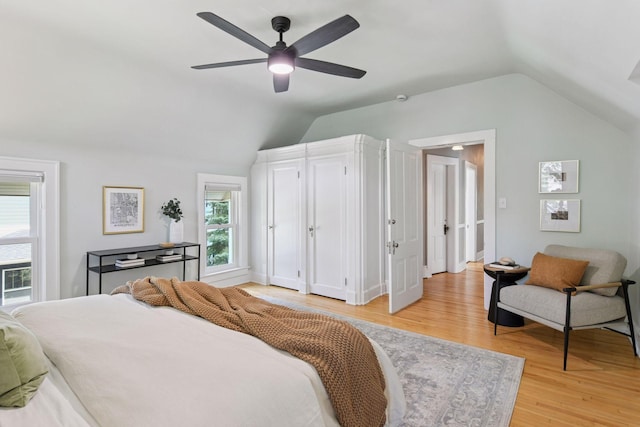 2432 Pleasant Ave, Minneapolis, MN 55404 - bedroom with vaulted ceiling, light wood-type flooring, and a ceiling fan