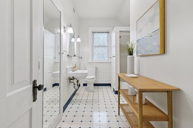 2432 Pleasant Ave, Minneapolis, MN 55404 - full bath with a stall shower, tile walls, and a wainscoted wall