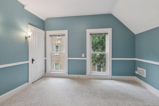 2432 Pleasant Ave, Minneapolis, MN 55404 - unfurnished room featuring lofted ceiling and carpet floors