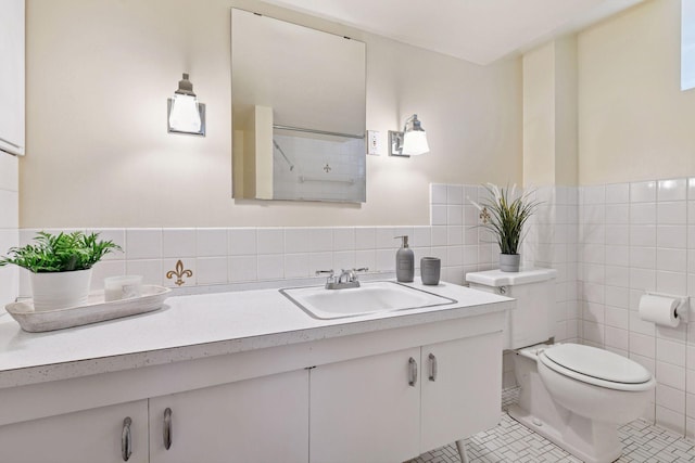 2432 Pleasant Ave, Minneapolis, MN 55404 - bathroom featuring tile walls, vanity, and tile patterned floors