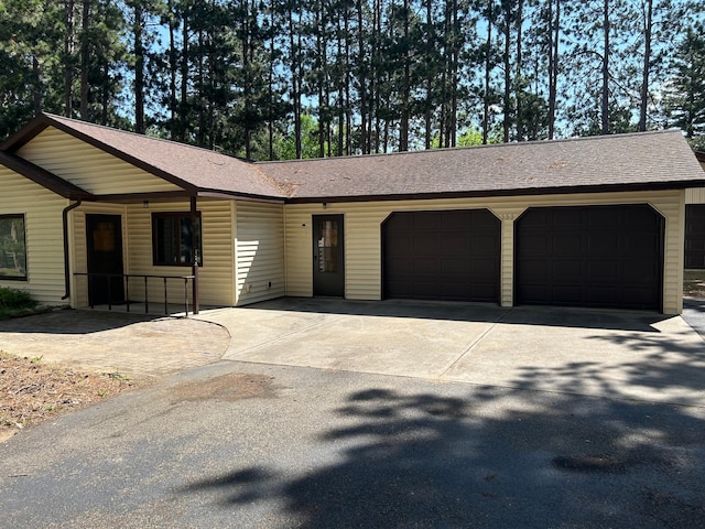 353 River Dr, Park Rapids, MN 56470 - single story home featuring an attached garage, driveway, and roof with shingles