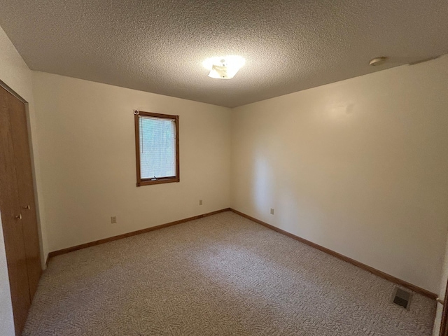 353 River Dr, Park Rapids, MN 56470 - unfurnished room featuring light colored carpet and a textured ceiling