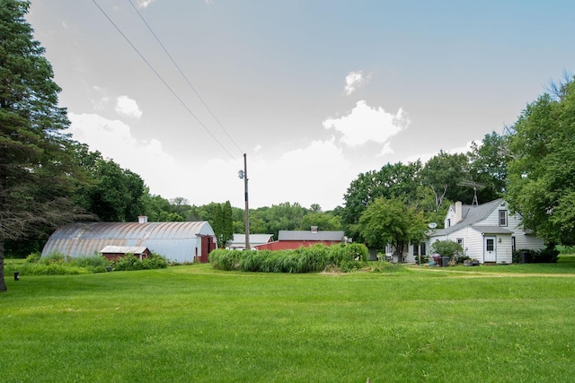 18726 Juneberry Rd, Mankato, MN 56001 - view of green lawn with an outdoor structure