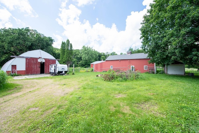 18726 Juneberry Rd, Mankato, MN 56001 - view of green lawn with an outbuilding and an outdoor structure