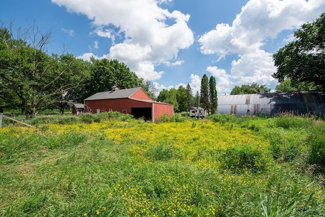 18726 Juneberry Rd, Mankato, MN 56001 - view of yard with an outbuilding and a garage