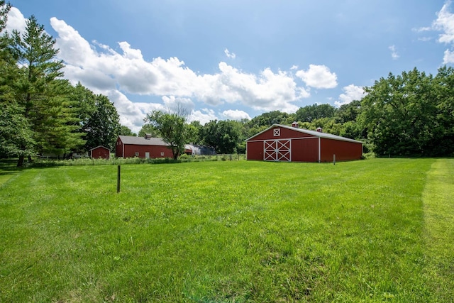 18726 Juneberry Rd, Mankato, MN 56001 - view of grassy yard featuring a barn and an outdoor structure