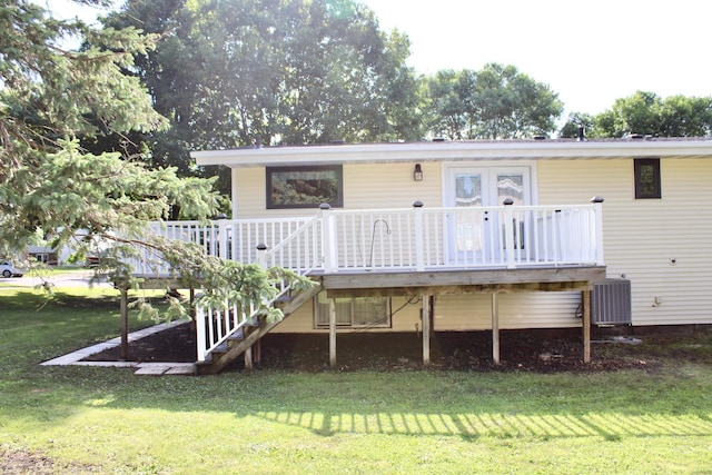 2001 25th St SW, Willmar, MN 56201 - rear view of house featuring a lawn, a deck, and stairway