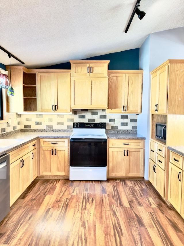 2001 25th St SW, Willmar, MN 56201 - kitchen featuring light brown cabinetry, lofted ceiling, appliances with stainless steel finishes, open shelves, and decorative backsplash