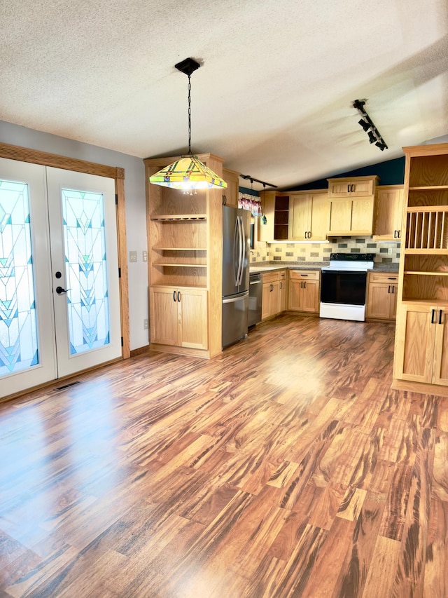 2001 25th St SW, Willmar, MN 56201 - kitchen featuring light brown cabinets, light wood-type flooring, tasteful backsplash, a textured ceiling, and lofted ceiling