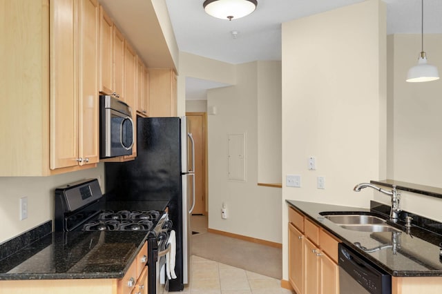 820 Emerald St SE Unit 314, Saint Paul, MN 55114 - kitchen featuring appliances with stainless steel finishes, dark stone countertops, light brown cabinetry, a peninsula, and light tile patterned floors