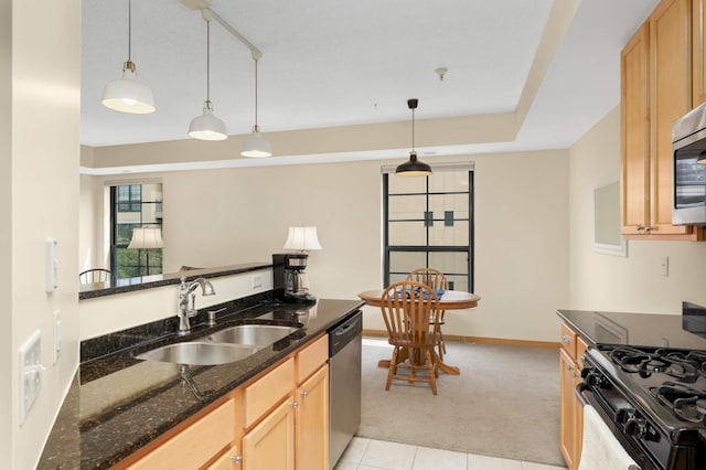 820 Emerald St SE Unit 314, Saint Paul, MN 55114 - kitchen with light colored carpet, appliances with stainless steel finishes, pendant lighting, dark stone counters, and light tile patterned floors