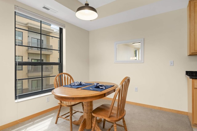 820 Emerald St SE Unit 314, Saint Paul, MN 55114 - dining space featuring light colored carpet and baseboards
