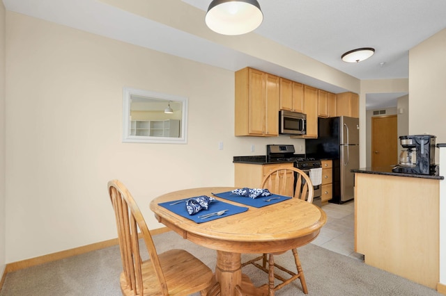820 Emerald St SE Unit 314, Saint Paul, MN 55114 - dining room with light carpet