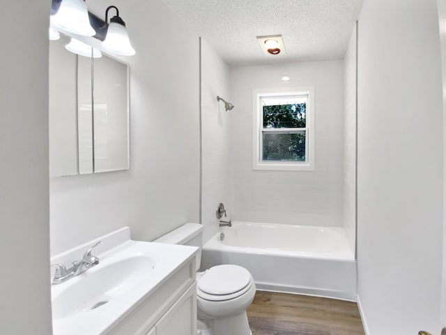 206 Winona St W, West Saint Paul, MN 55118 - full bath featuring wood finished floors, vanity, a textured ceiling, and shower / bathtub combination