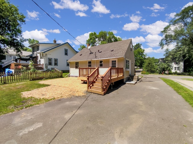 206 Winona St W, West Saint Paul, MN 55118 - back of property featuring a wooden deck and a shingled roof