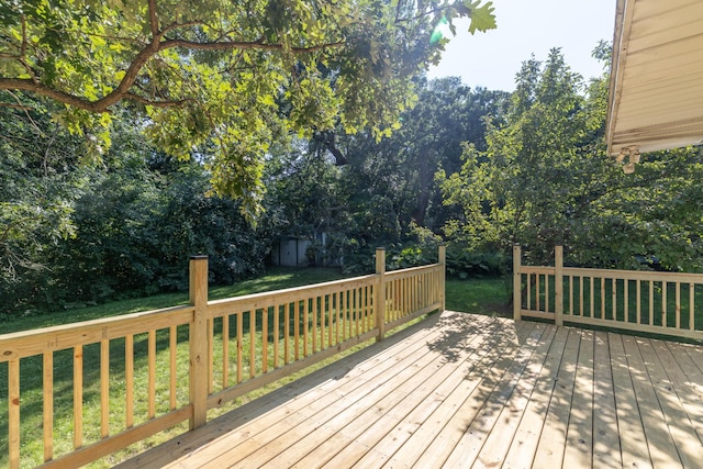 110 Hamilton Dr, River Falls, WI 54022 - wooden terrace featuring a lawn