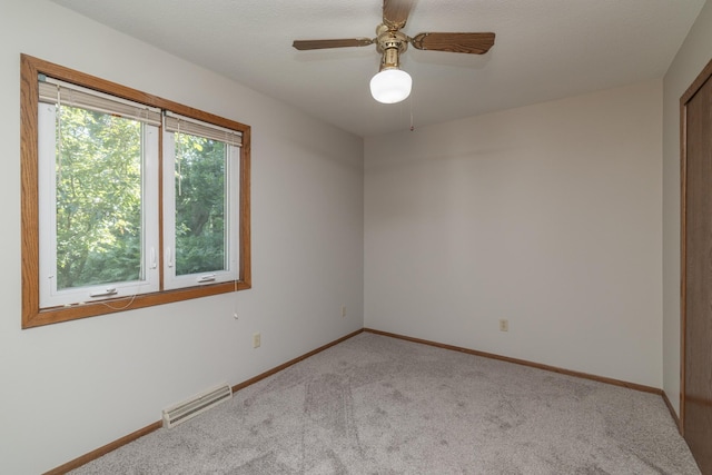 110 Hamilton Dr, River Falls, WI 54022 - carpeted spare room featuring baseboards and a ceiling fan
